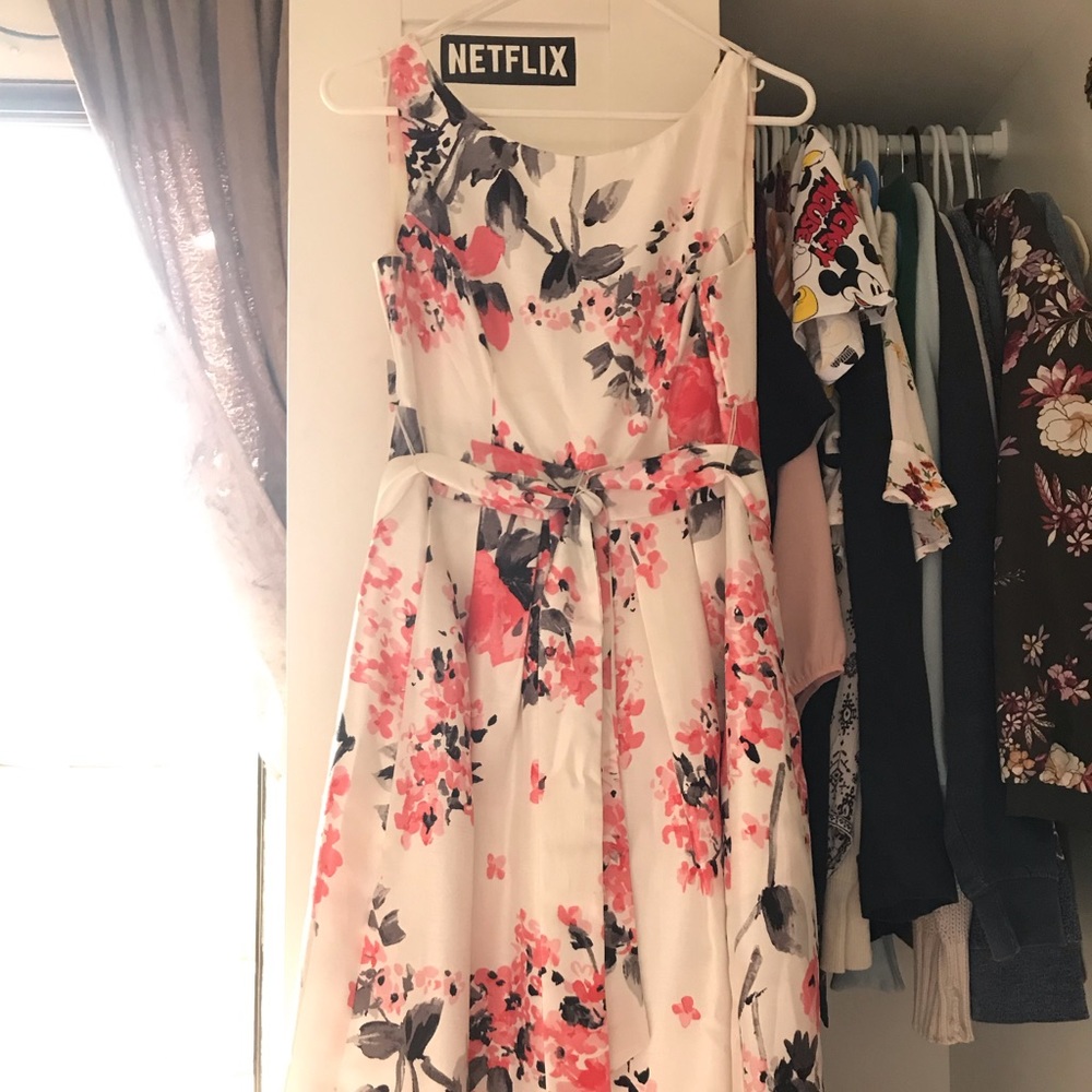 It’s a white colored dress with pink floral design